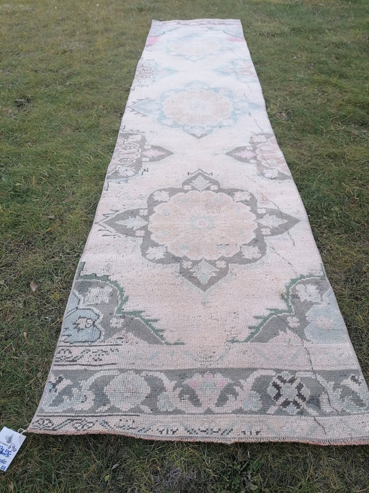 2.5 x 10.7 Muted runner rug vintage turkish runner rug, oushak rug, anatolian rug handmade